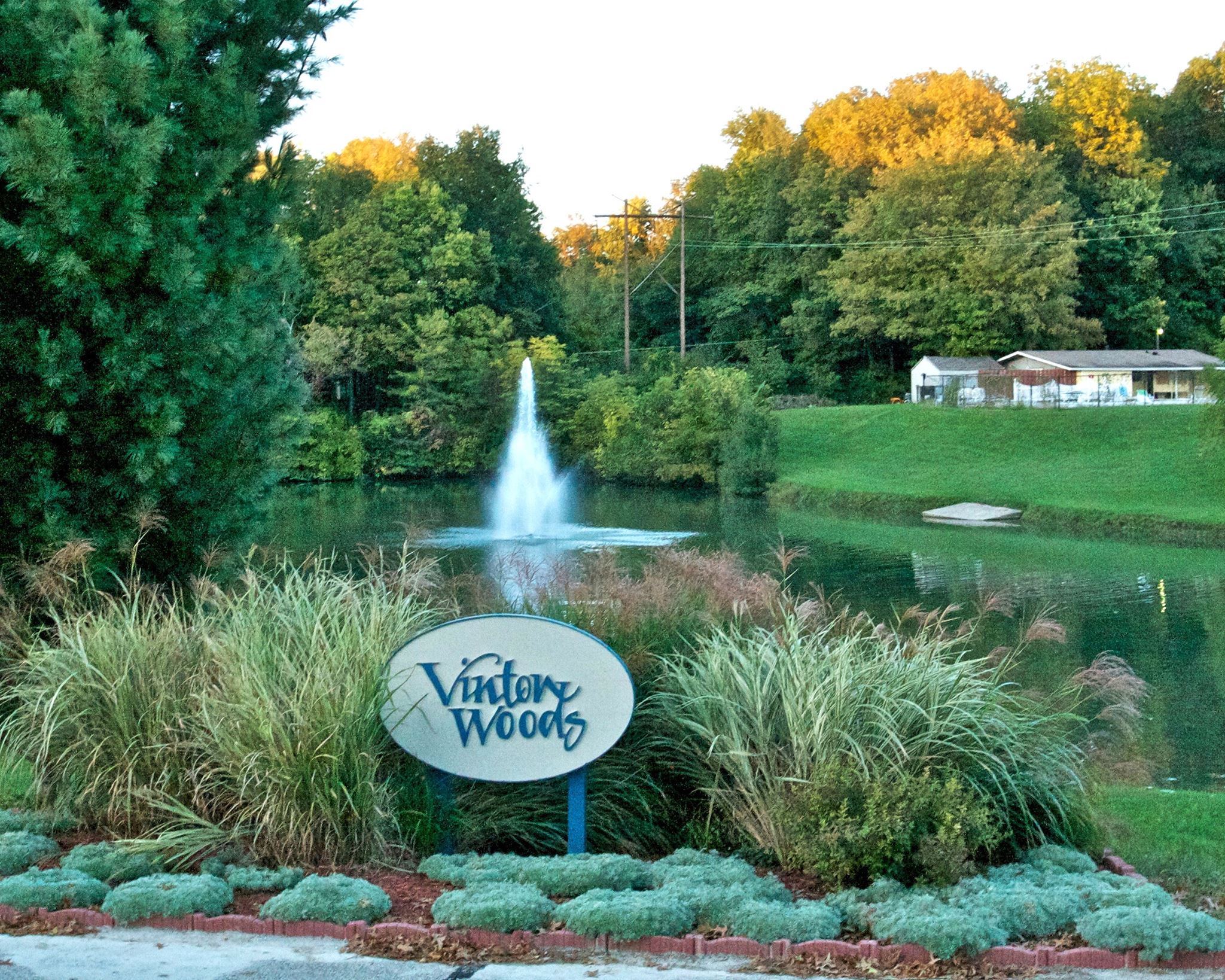 View of Vinton Woods pond and clubhouse in the background